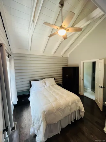 a bedroom with a bed and a closet