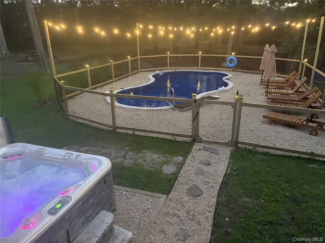 a view of a swimming pool with an outdoor kitchen