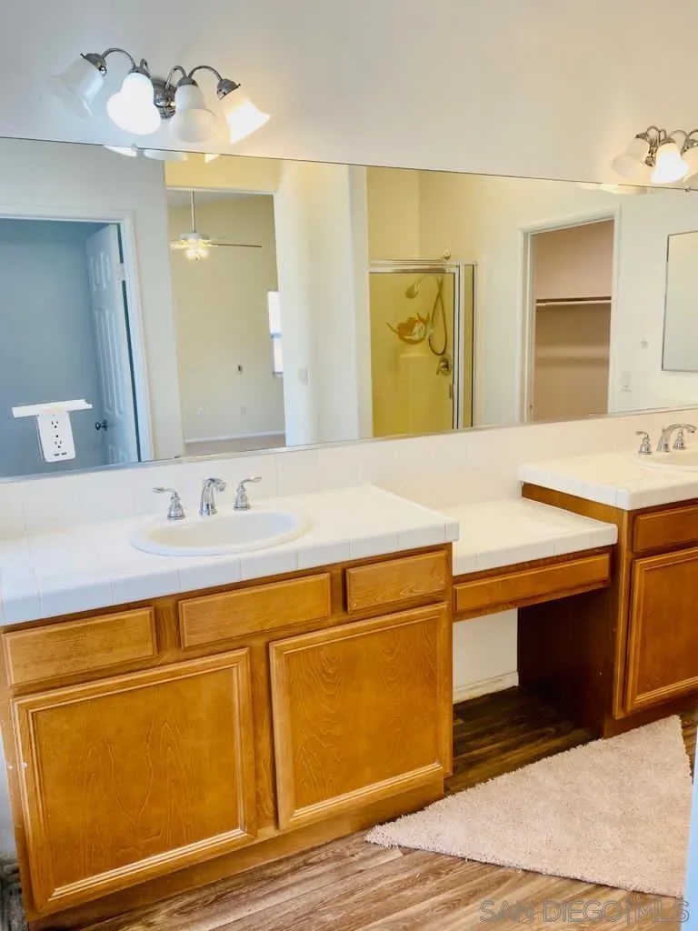914 Aria Road Hemet, CA 92543 - Photo 14 of 27 a bathroom with a sink and a mirror