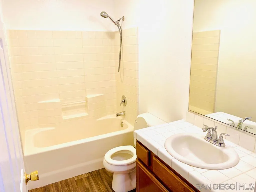 914 Aria Road Hemet, CA 92543 - Photo 15 of 27 a bathroom with a sink and a mirror
