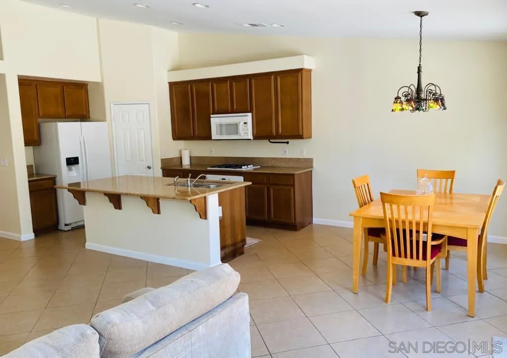 914 Aria Road Hemet, CA 92543 - Photo 7 of 27 a kitchen with stainless steel appliances granite countertop a sink a stove and a refrigerator