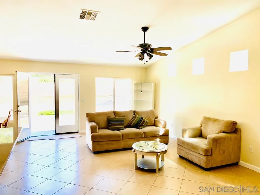914 Aria Road Hemet, CA 92543 - Photo 9 of 27 a living room with furniture and a large window