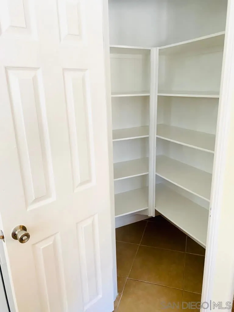 914 Aria Road Hemet, CA 92543 - Photo 10 of 27 a view of walk in closet with empty racks