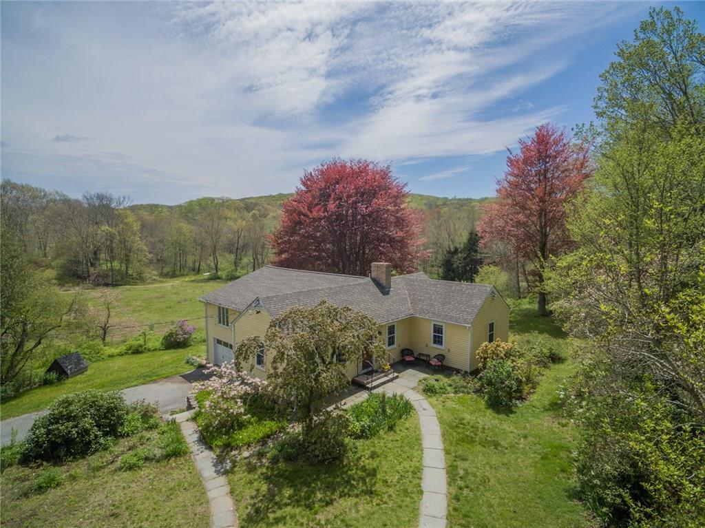 an aerial view of residential house with outdoor space