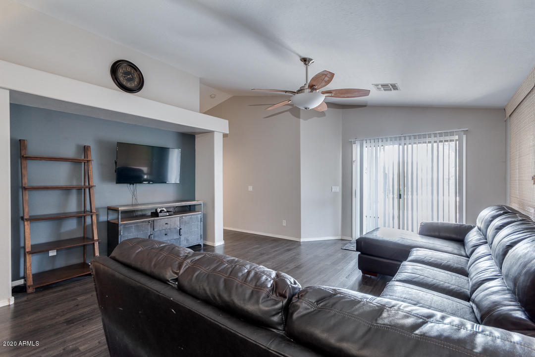 3339 East Bonanza Road Gilbert, AZ 85297 - Photo 11 of 47 a living room with furniture and a flat screen tv