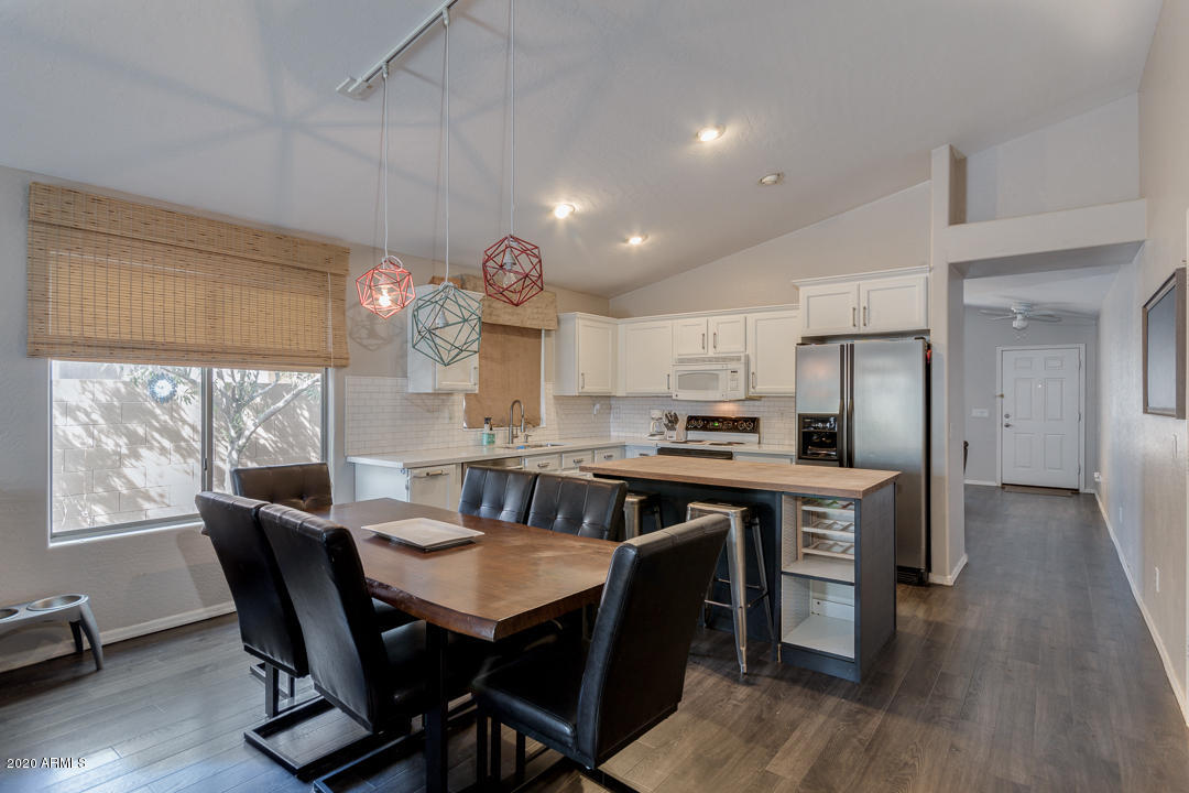3339 East Bonanza Road Gilbert, AZ 85297 - Photo 12 of 47 a view of a dining room with furniture window and wooden floor
