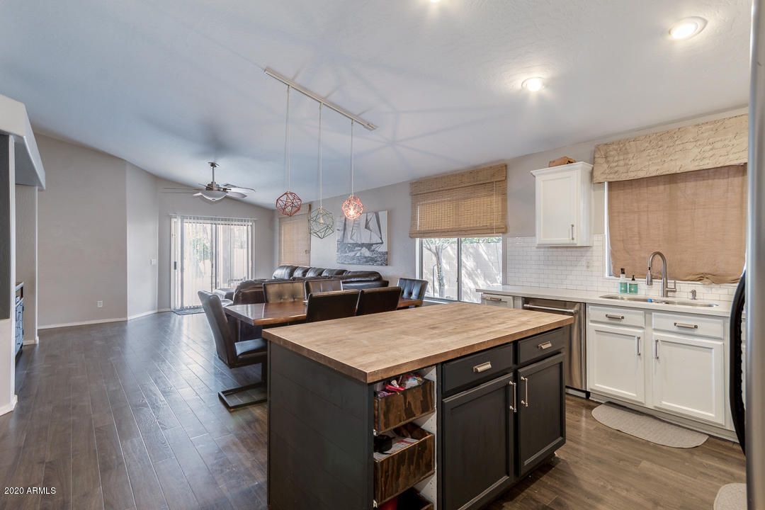 3339 East Bonanza Road Gilbert, AZ 85297 - Photo 17 of 47 a kitchen with a stove a sink dishwasher and a refrigerator