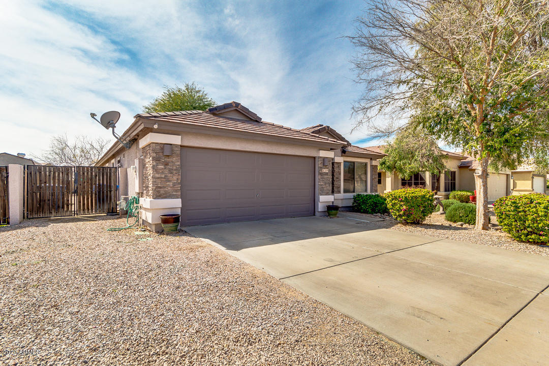 3339 East Bonanza Road Gilbert, AZ 85297 - Photo 2 of 47 a front view of a house with a yard and garage