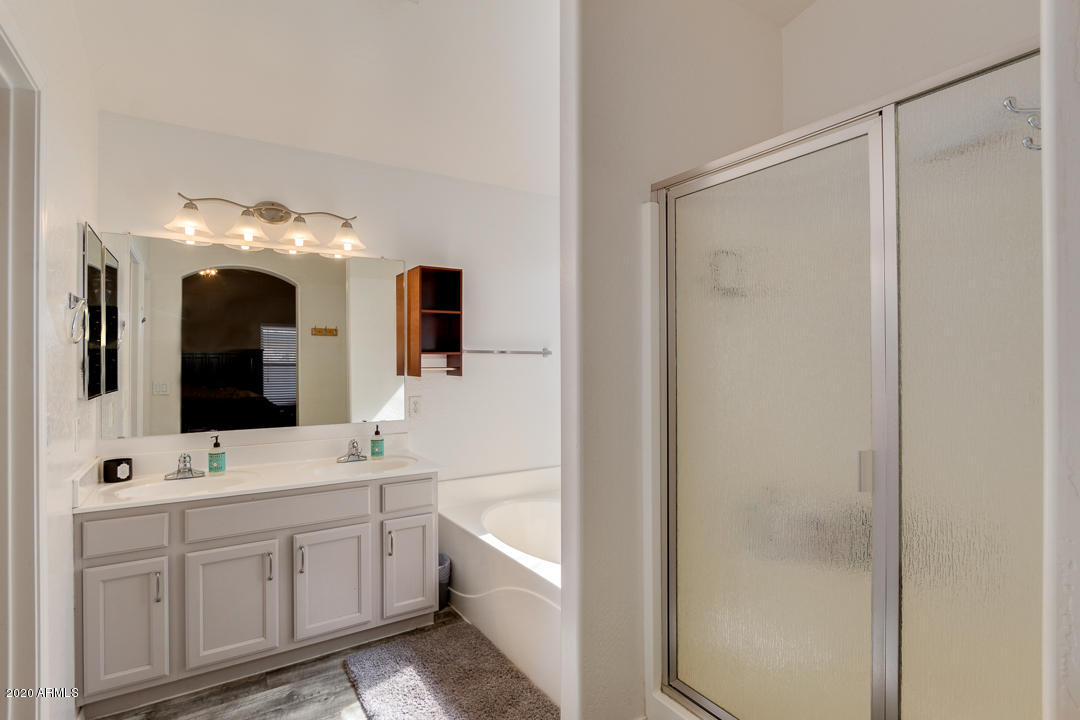 3339 East Bonanza Road Gilbert, AZ 85297 - Photo 23 of 47 a bathroom with a double vanity sink mirror and bathtub