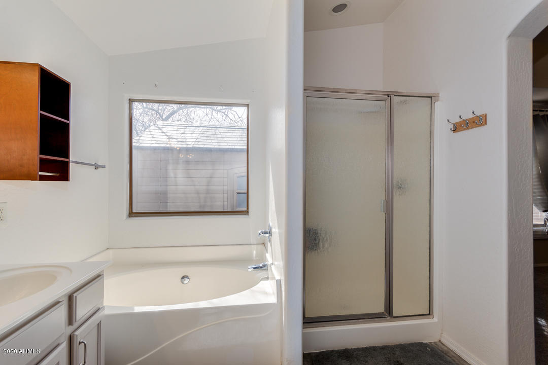 3339 East Bonanza Road Gilbert, AZ 85297 - Photo 25 of 47 a bathroom with a bathtub and a shower
