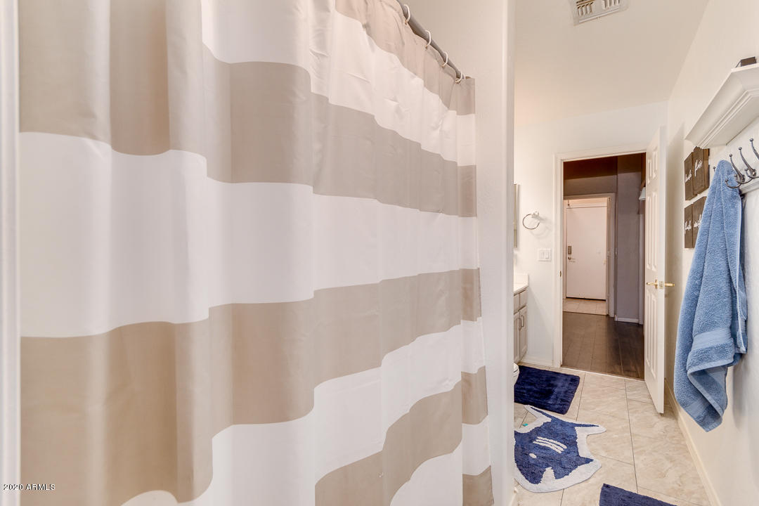 3339 East Bonanza Road Gilbert, AZ 85297 - Photo 27 of 47 a bathroom with a bathtub and shower