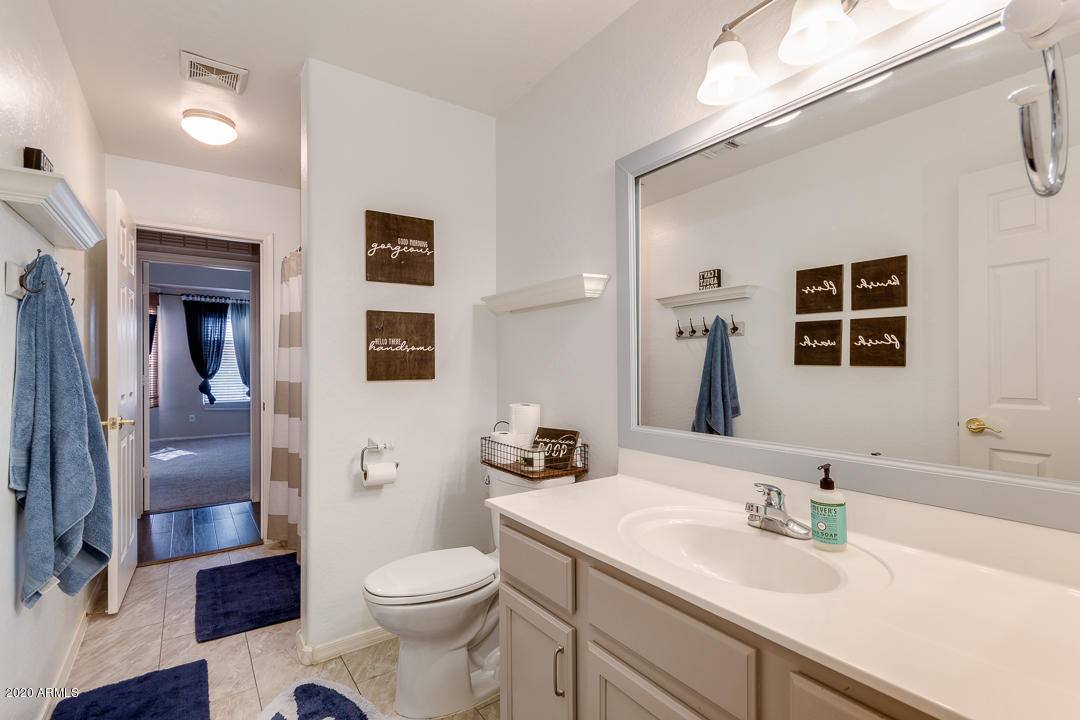 3339 East Bonanza Road Gilbert, AZ 85297 - Photo 28 of 47 a bathroom with a sink a toilet and shower