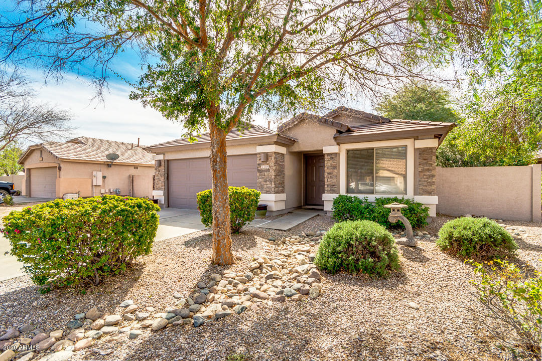 3339 East Bonanza Road Gilbert, AZ 85297 - Photo 3 of 47 a front view of a house with garden