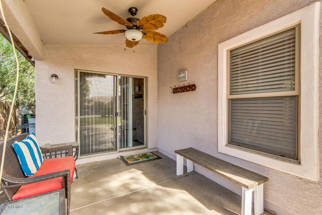 3339 East Bonanza Road Gilbert, AZ 85297 - Photo 33 of 47 a living room with furniture and a window