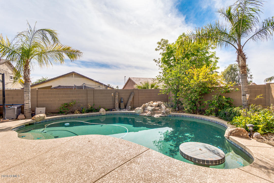 3339 East Bonanza Road Gilbert, AZ 85297 - Photo 39 of 47 a view of a backyard with swimming pool