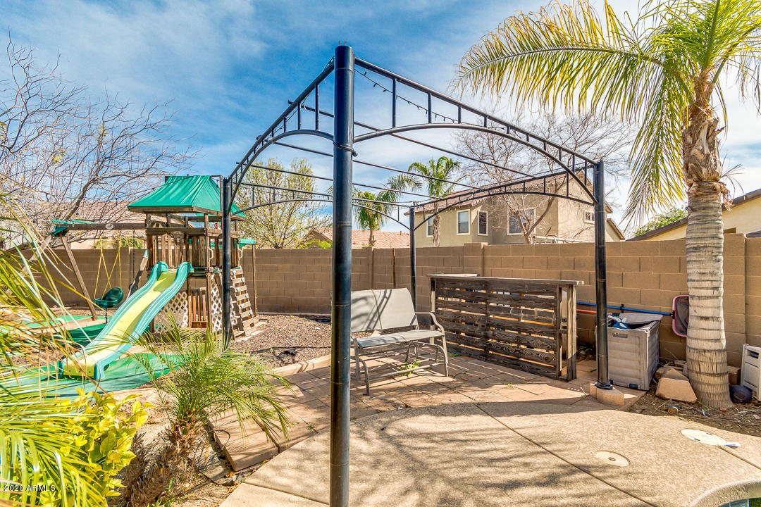 3339 East Bonanza Road Gilbert, AZ 85297 - Photo 42 of 47 a building with trees in the background