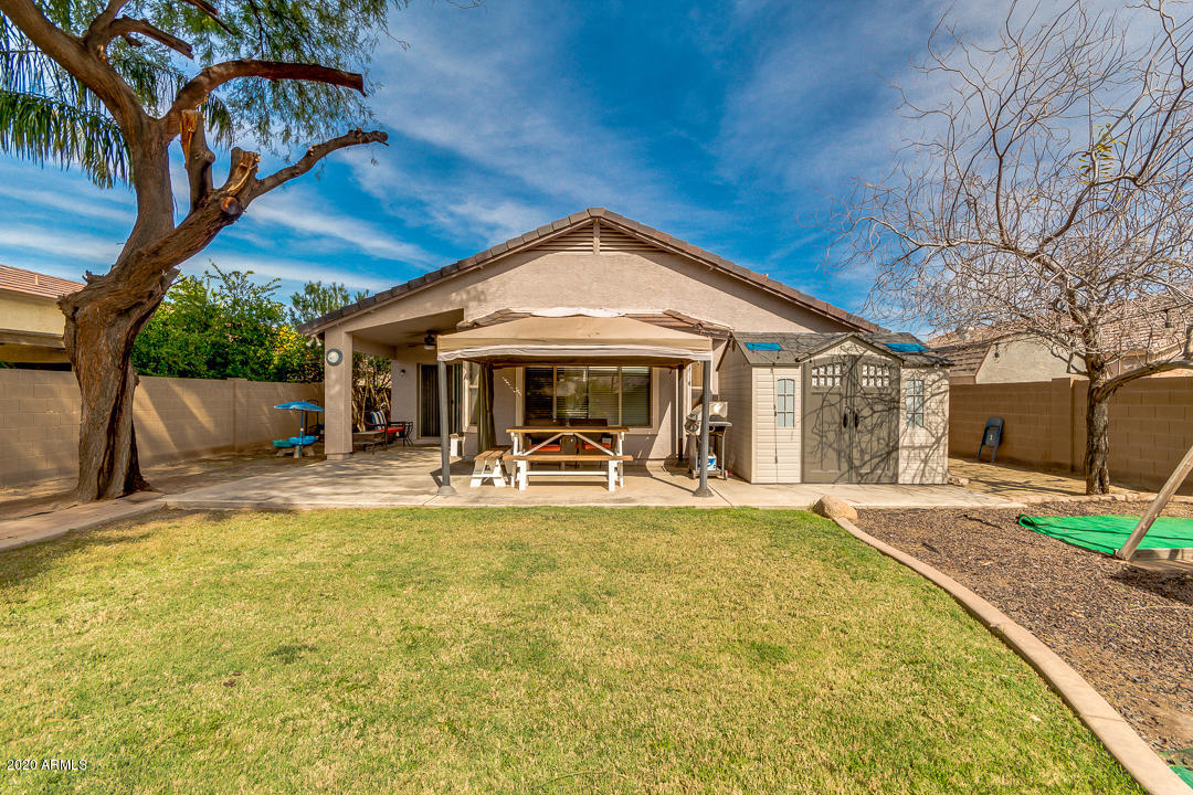 3339 East Bonanza Road Gilbert, AZ 85297 - Photo 46 of 47 a front view of a house with swimming pool having outdoor seating