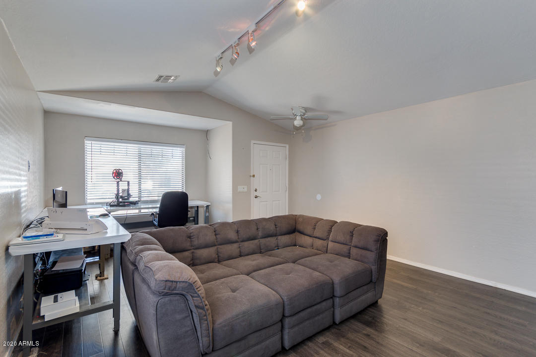 3339 East Bonanza Road Gilbert, AZ 85297 - Photo 6 of 47 a living room with furniture and wooden floor