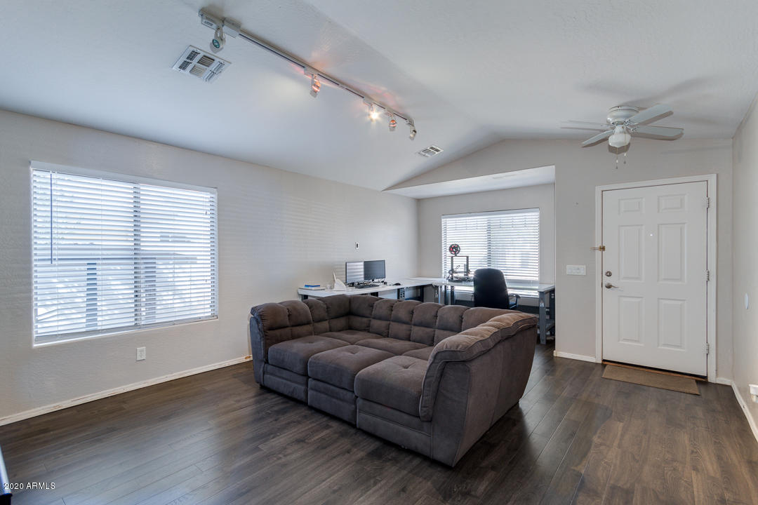 3339 East Bonanza Road Gilbert, AZ 85297 - Photo 7 of 47 a living room with furniture and a window
