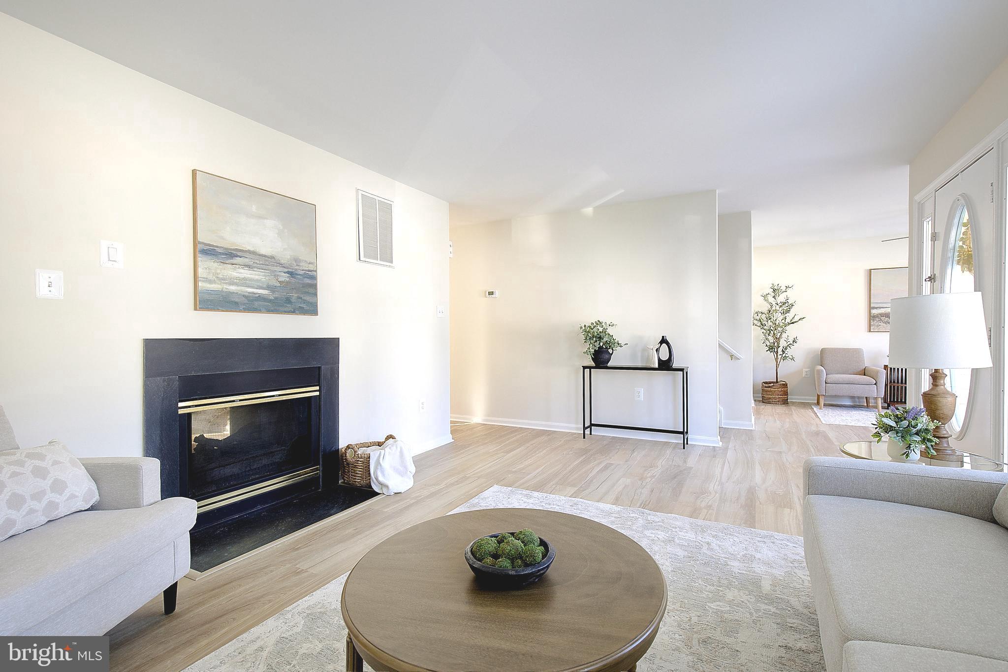 8714 C Street Chesapeake Beach, MD 20732 - Photo 12 of 66 a living room with furniture and a fireplace