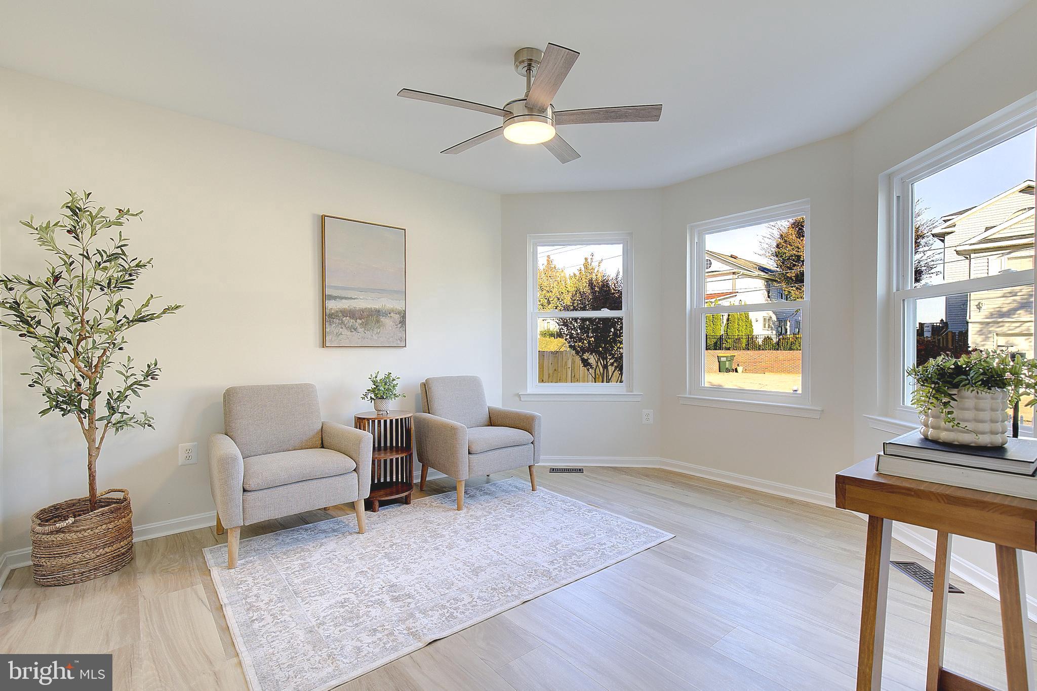 8714 C Street Chesapeake Beach, MD 20732 - Photo 14 of 66 a living room with furniture and windows