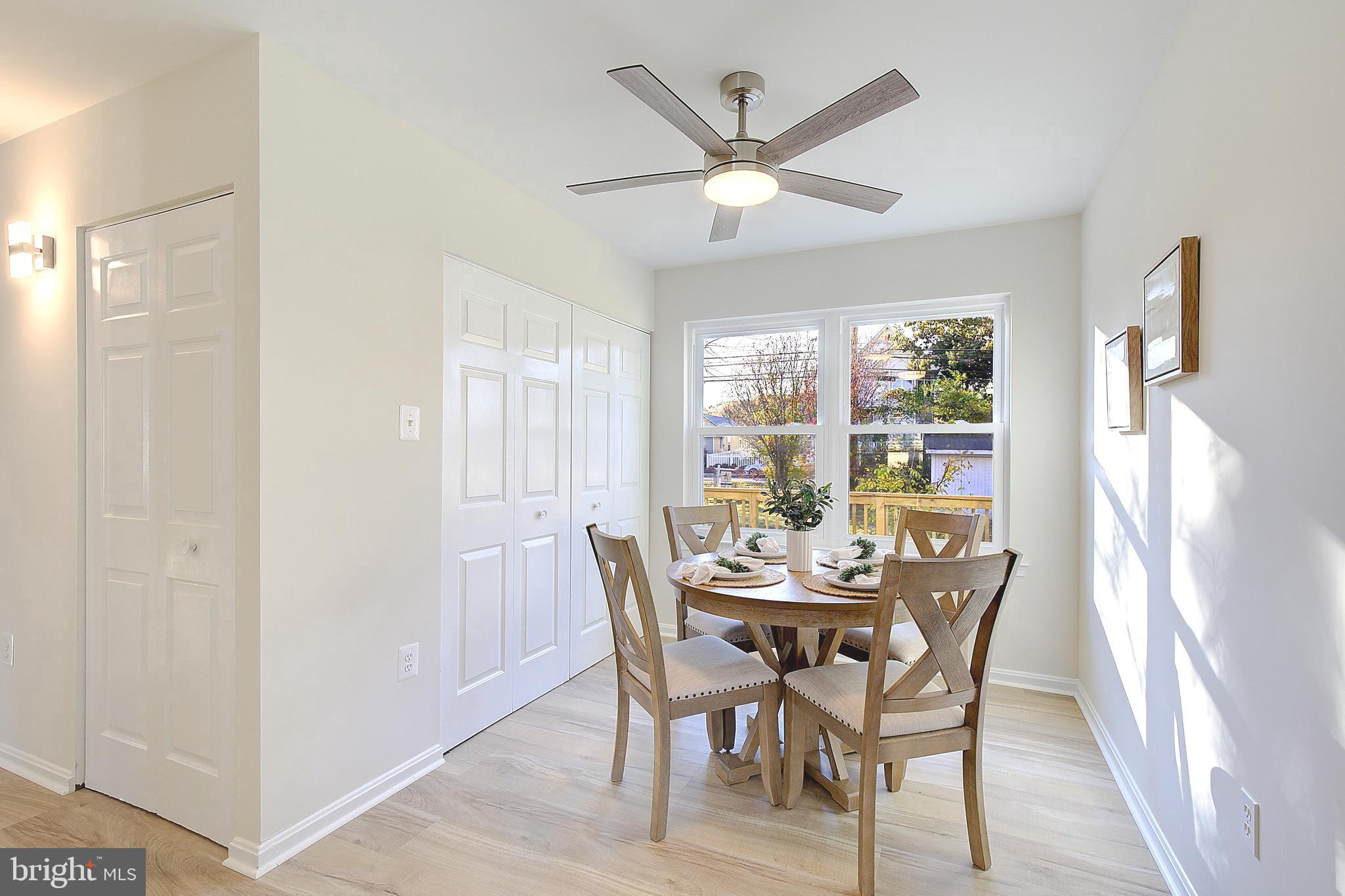 8714 C Street Chesapeake Beach, MD 20732 - Photo 21 of 66 a view of a dining room with furniture window and wooden floor