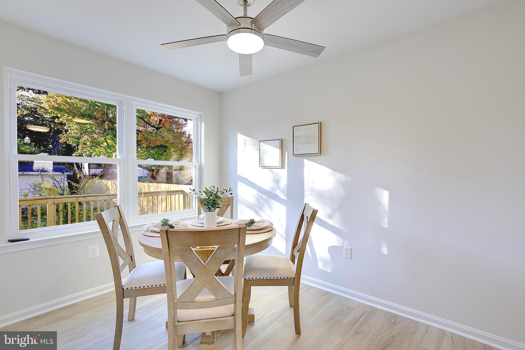 8714 C Street Chesapeake Beach, MD 20732 - Photo 22 of 66 a view of a dining room with furniture window and outside view