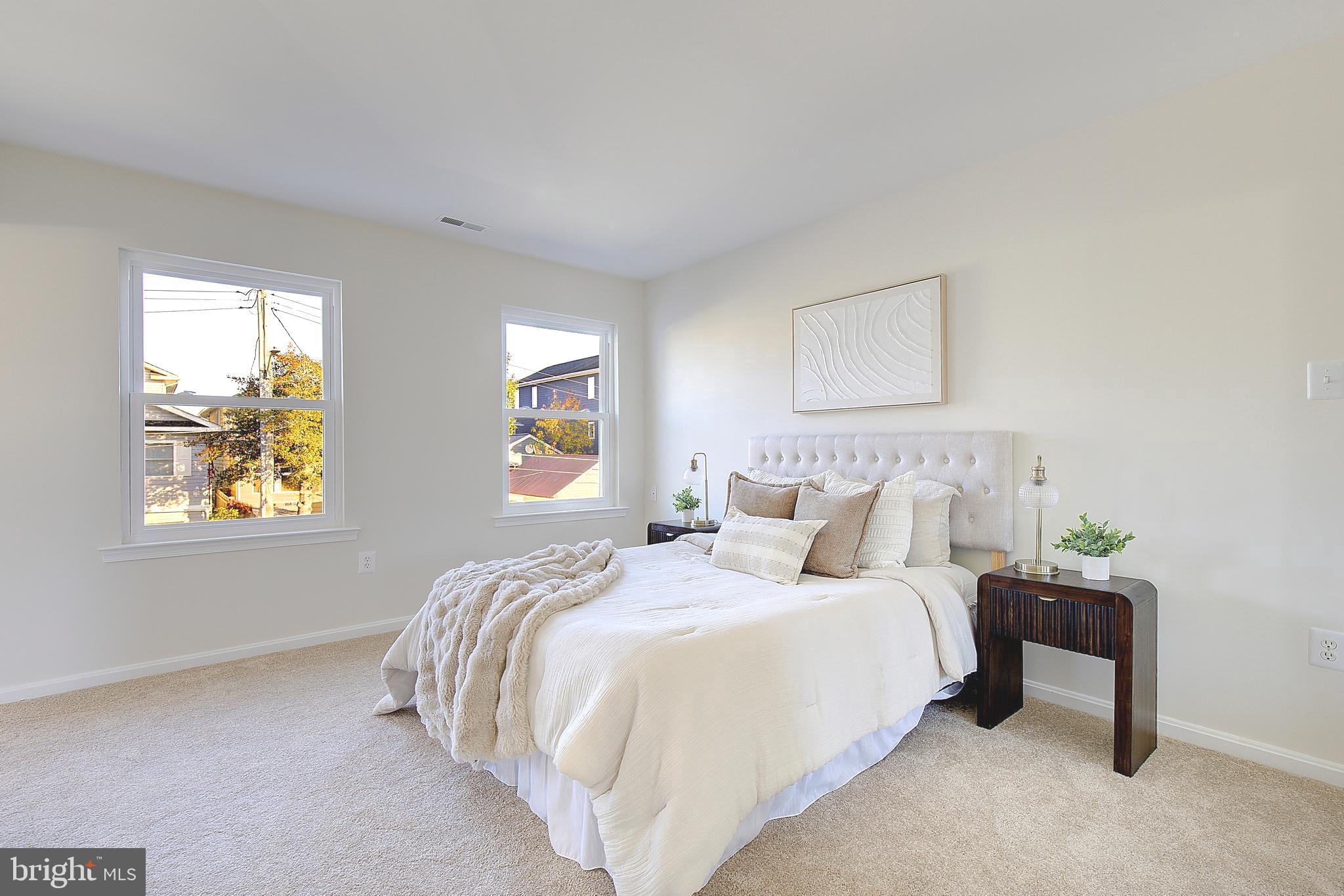 8714 C Street Chesapeake Beach, MD 20732 - Photo 28 of 66 a bedroom with bed and a window