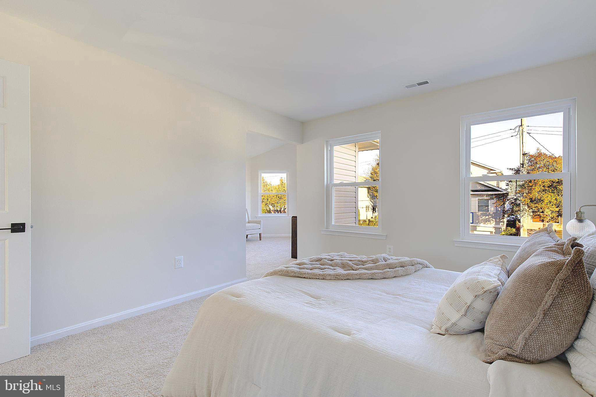 8714 C Street Chesapeake Beach, MD 20732 - Photo 29 of 66 a bedroom with a bed and a window