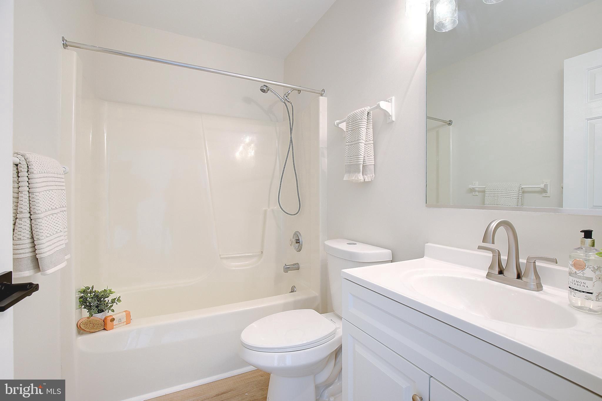 8714 C Street Chesapeake Beach, MD 20732 - Photo 42 of 66 a bathroom with a sink toilet and shower