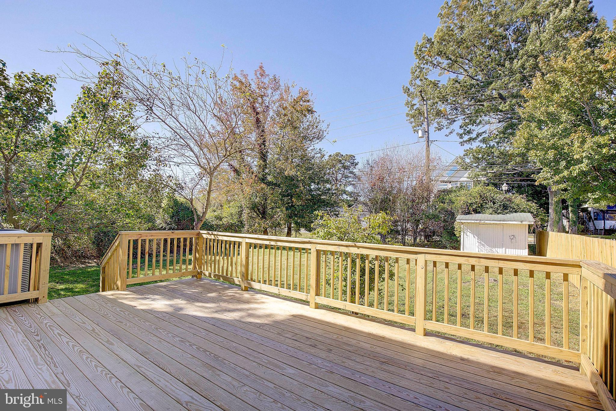 8714 C Street Chesapeake Beach, MD 20732 - Photo 43 of 66 a view of balcony with wooden floor and fence