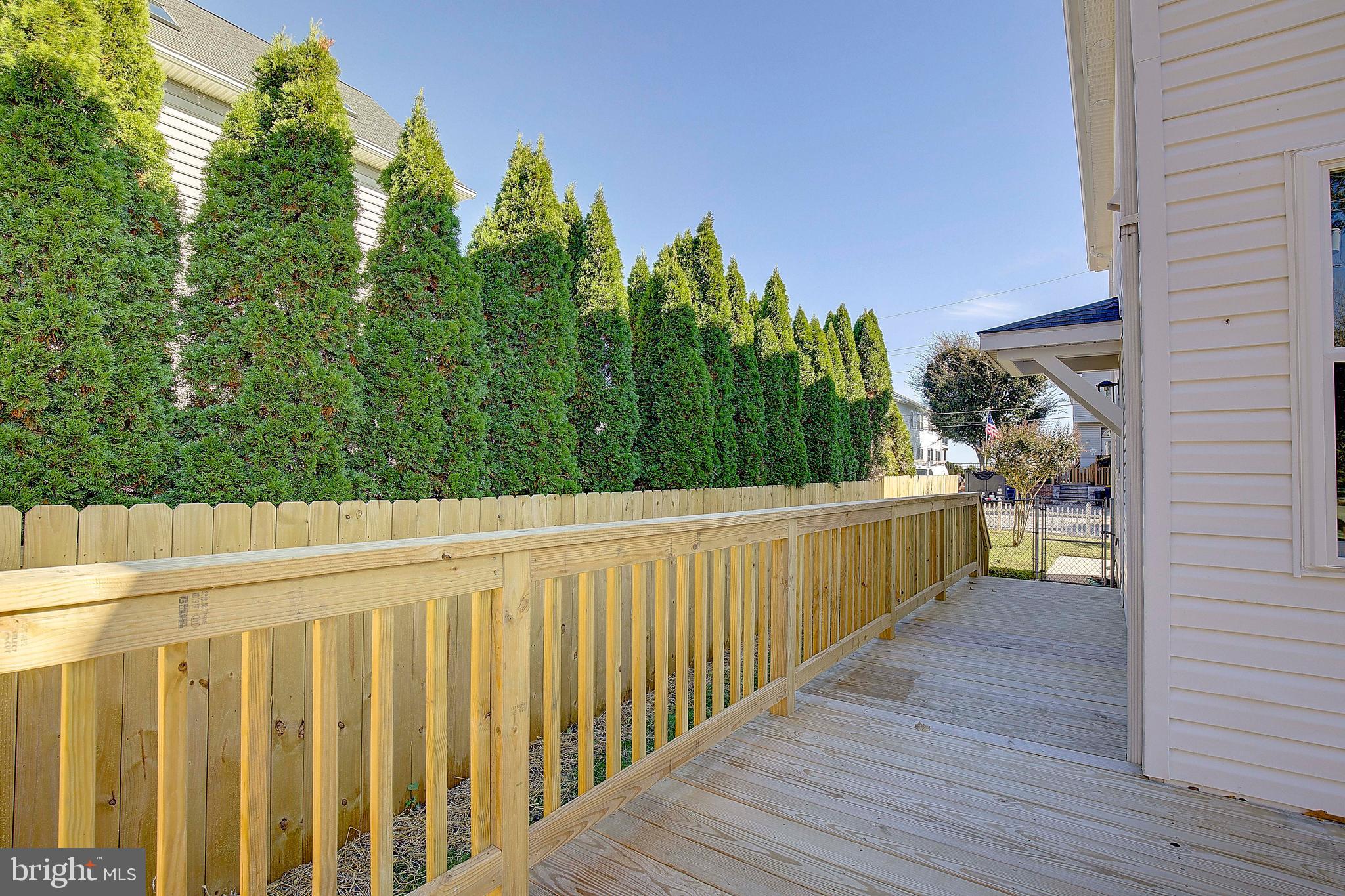 8714 C Street Chesapeake Beach, MD 20732 - Photo 44 of 66 a view of a pathway of a balcony with wooden floor