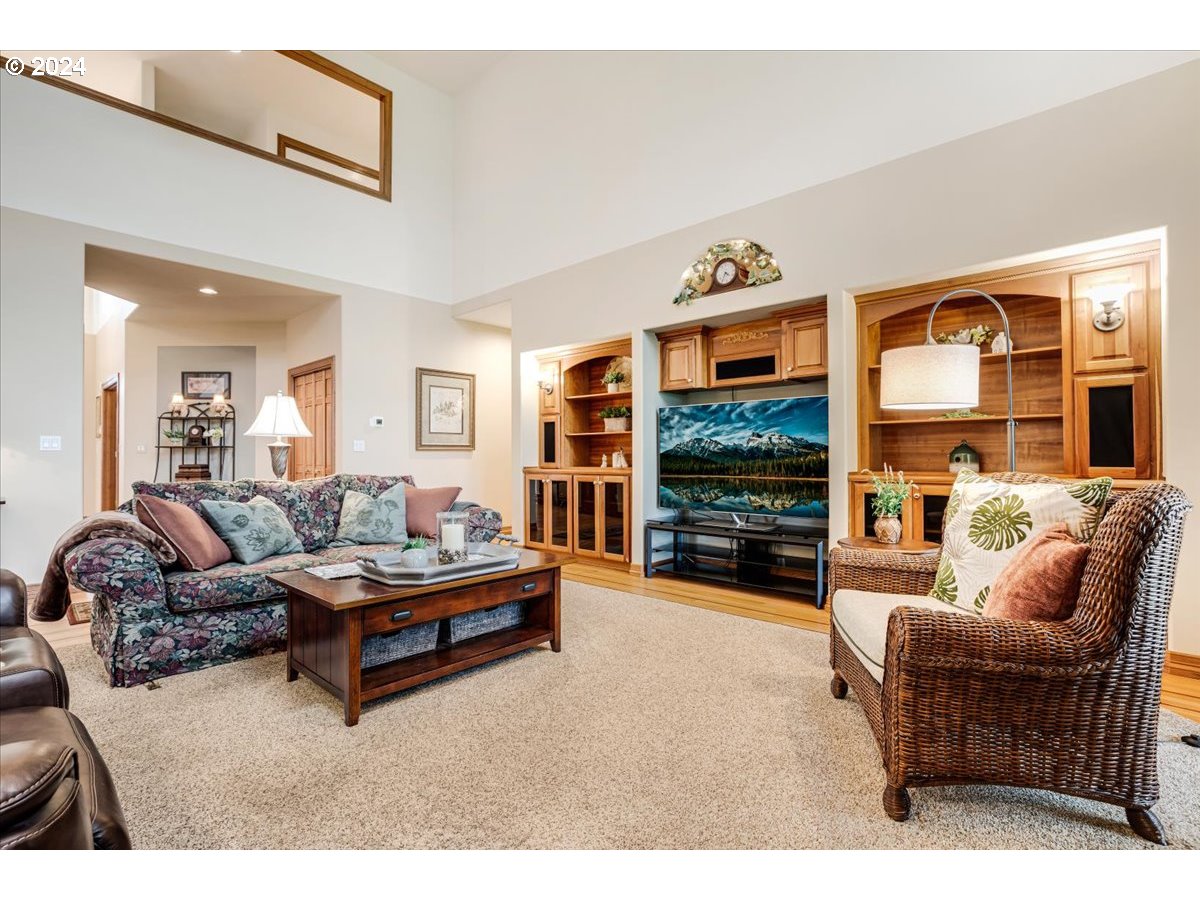 31938 Southeast Dodge Park Boulevard Gresham, OR 97080 - Photo 11 of 48 a living room with furniture and a flat screen tv