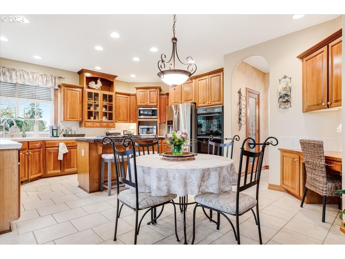 31938 Southeast Dodge Park Boulevard Gresham, OR 97080 - Photo 16 of 48 a view of a dining room with furniture
