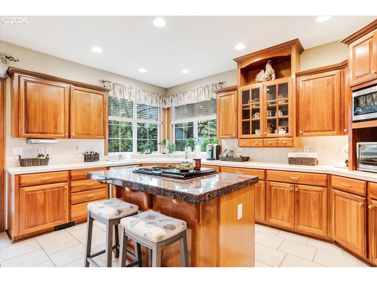 31938 Southeast Dodge Park Boulevard Gresham, OR 97080 - Photo 18 of 48 a kitchen with stainless steel appliances granite countertop a sink and cabinets
