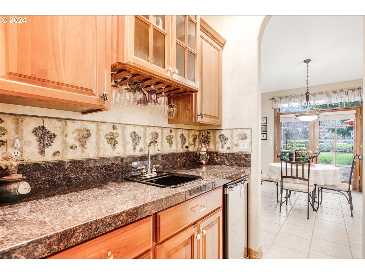 31938 Southeast Dodge Park Boulevard Gresham, OR 97080 - Photo 20 of 48 a kitchen with a stove a sink and a cabinets