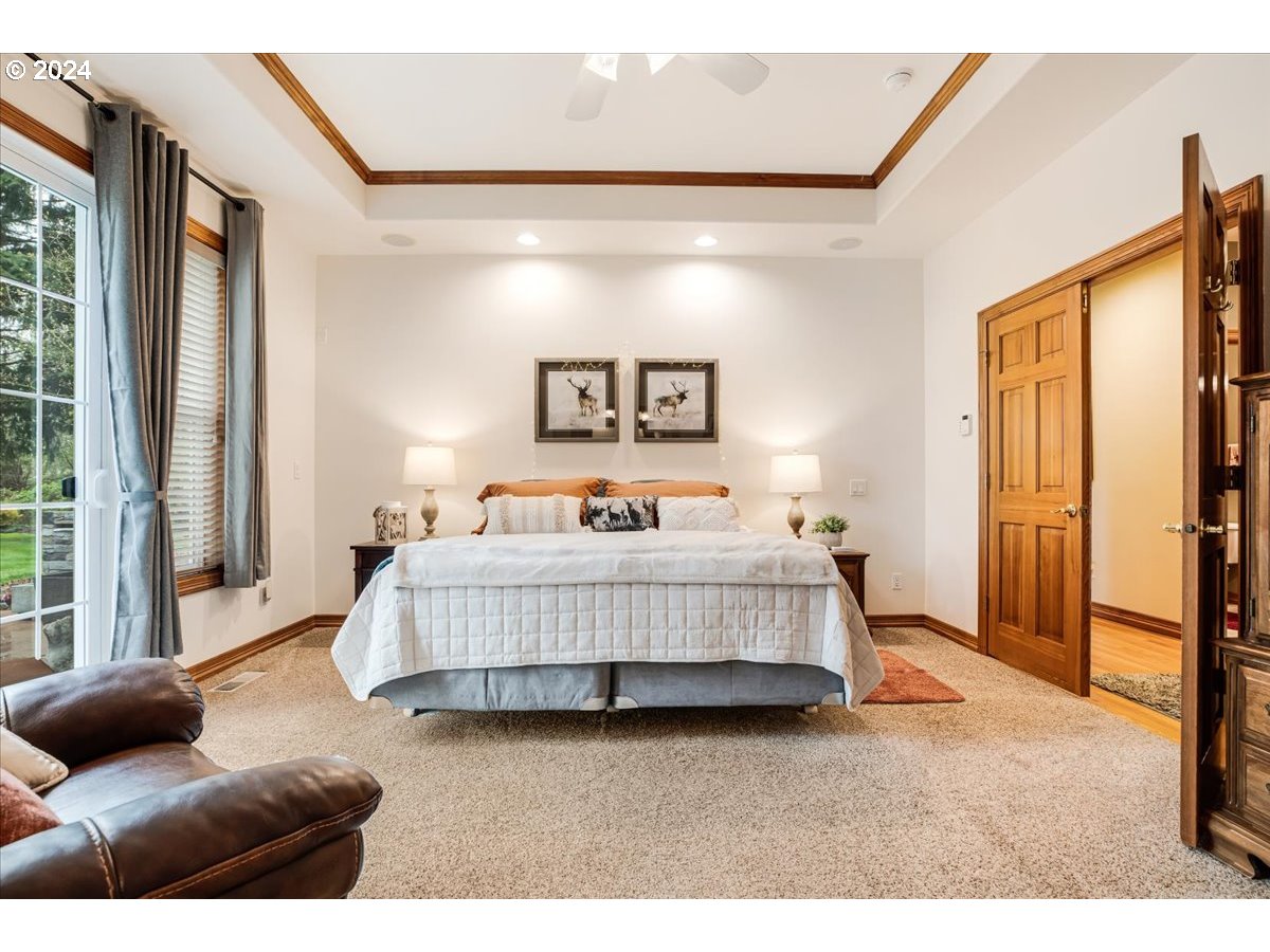 31938 Southeast Dodge Park Boulevard Gresham, OR 97080 - Photo 24 of 48 a bedroom with bed and a couch