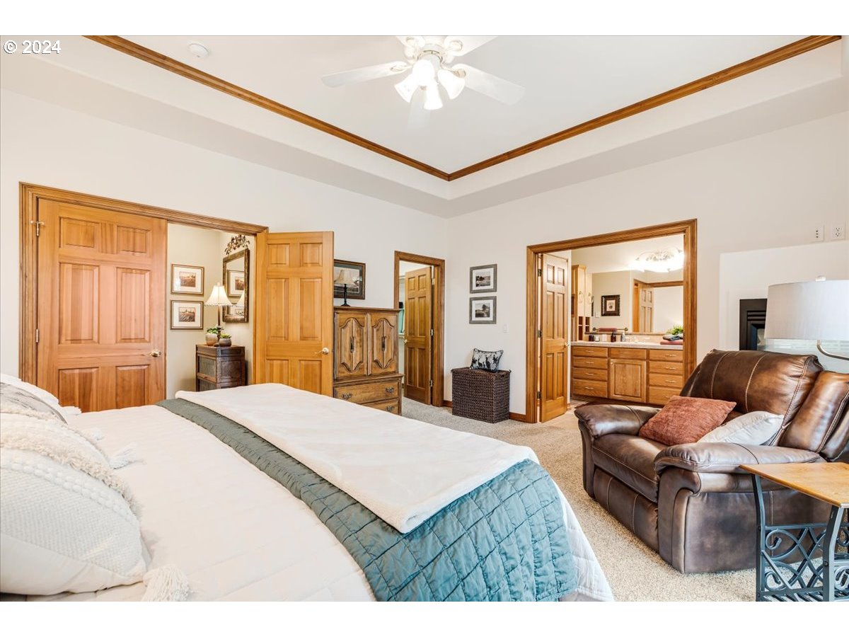 31938 Southeast Dodge Park Boulevard Gresham, OR 97080 - Photo 26 of 48 a bedroom with a bed and wooden floor