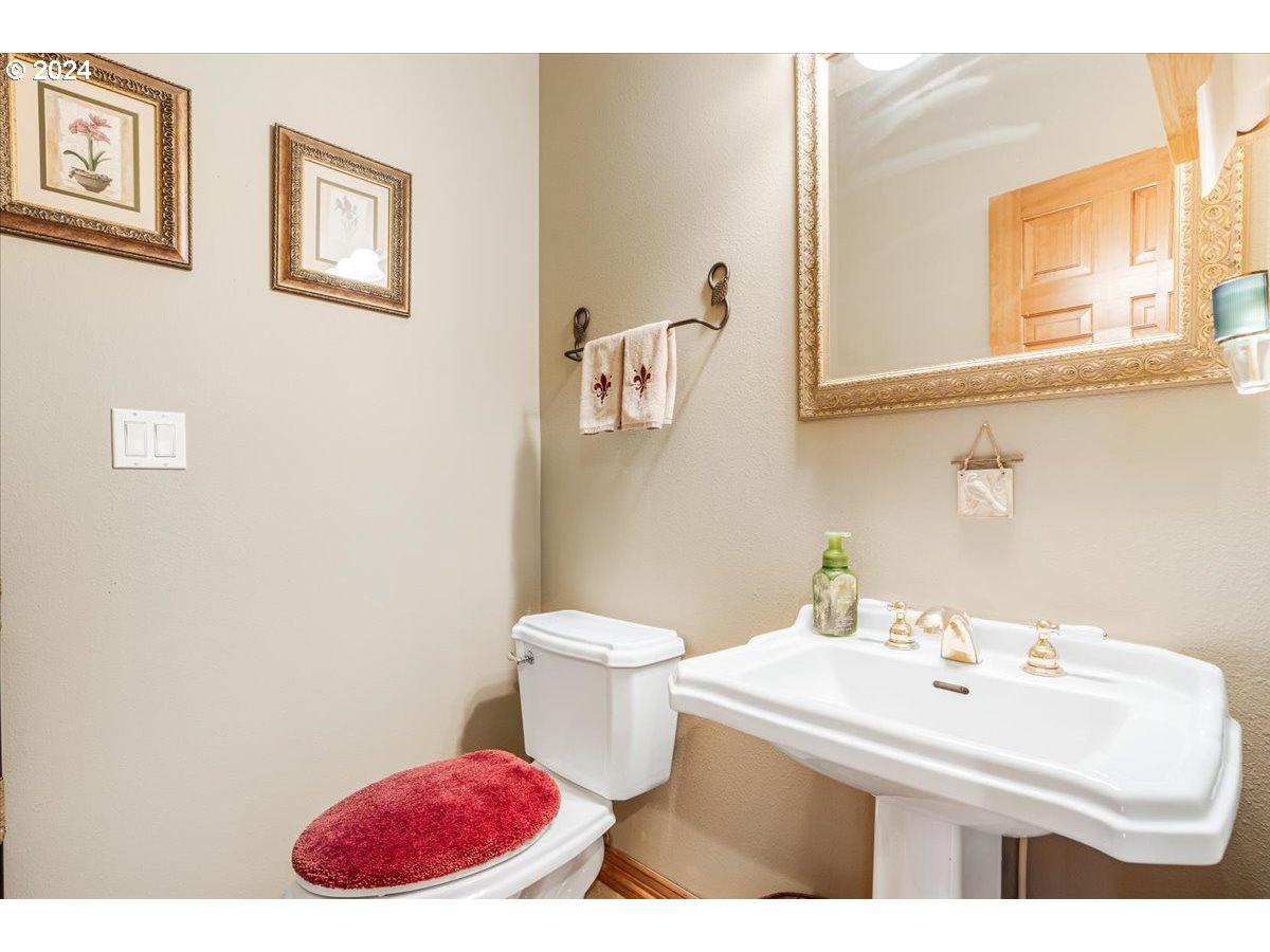 31938 Southeast Dodge Park Boulevard Gresham, OR 97080 - Photo 30 of 48 a bathroom with a sink and a mirror