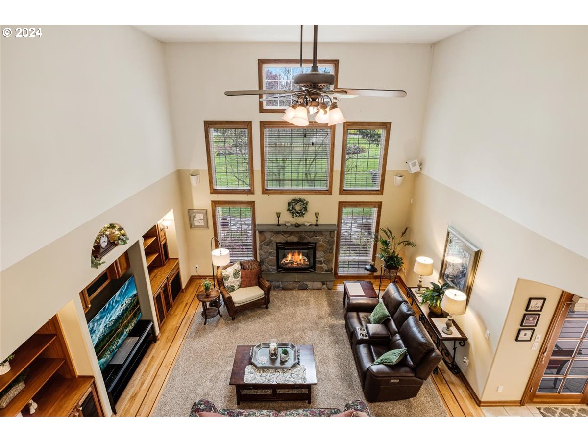 31938 Southeast Dodge Park Boulevard Gresham, OR 97080 - Photo 32 of 48 a living room with furniture and a fireplace
