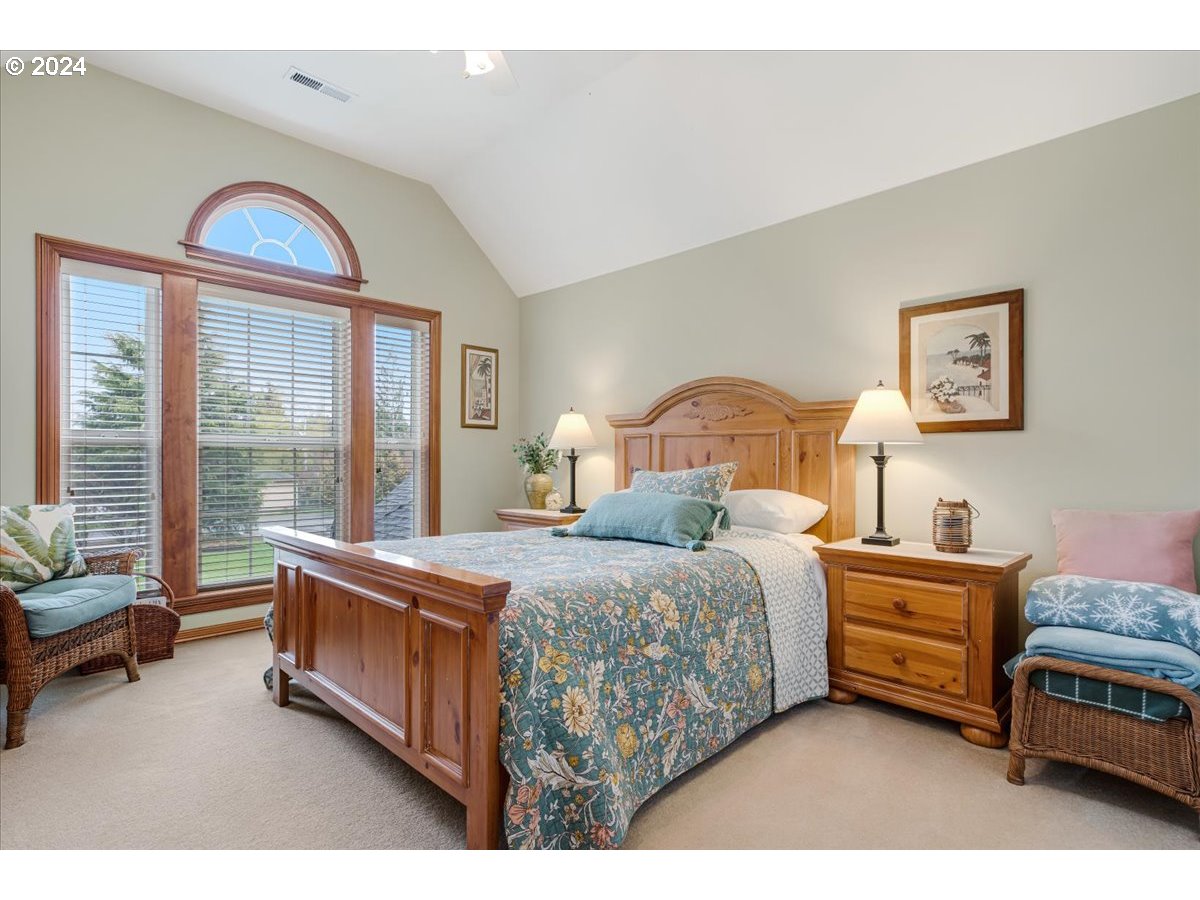 31938 Southeast Dodge Park Boulevard Gresham, OR 97080 - Photo 35 of 48 a bedroom with a bed and a couch