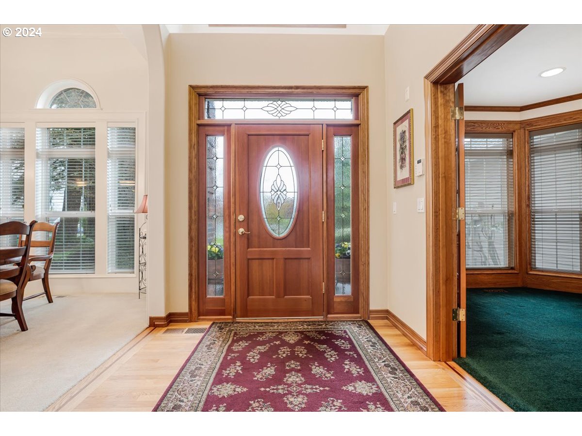 31938 Southeast Dodge Park Boulevard Gresham, OR 97080 - Photo 4 of 48 a view of a entryway door with wooden floor