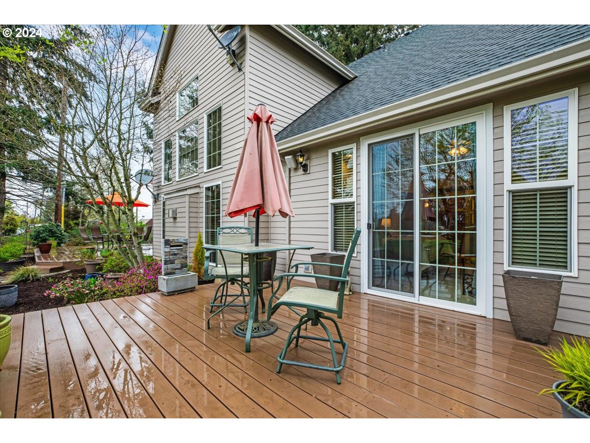 31938 Southeast Dodge Park Boulevard Gresham, OR 97080 - Photo 44 of 48 a view of a chairs and table on the deck in front of house