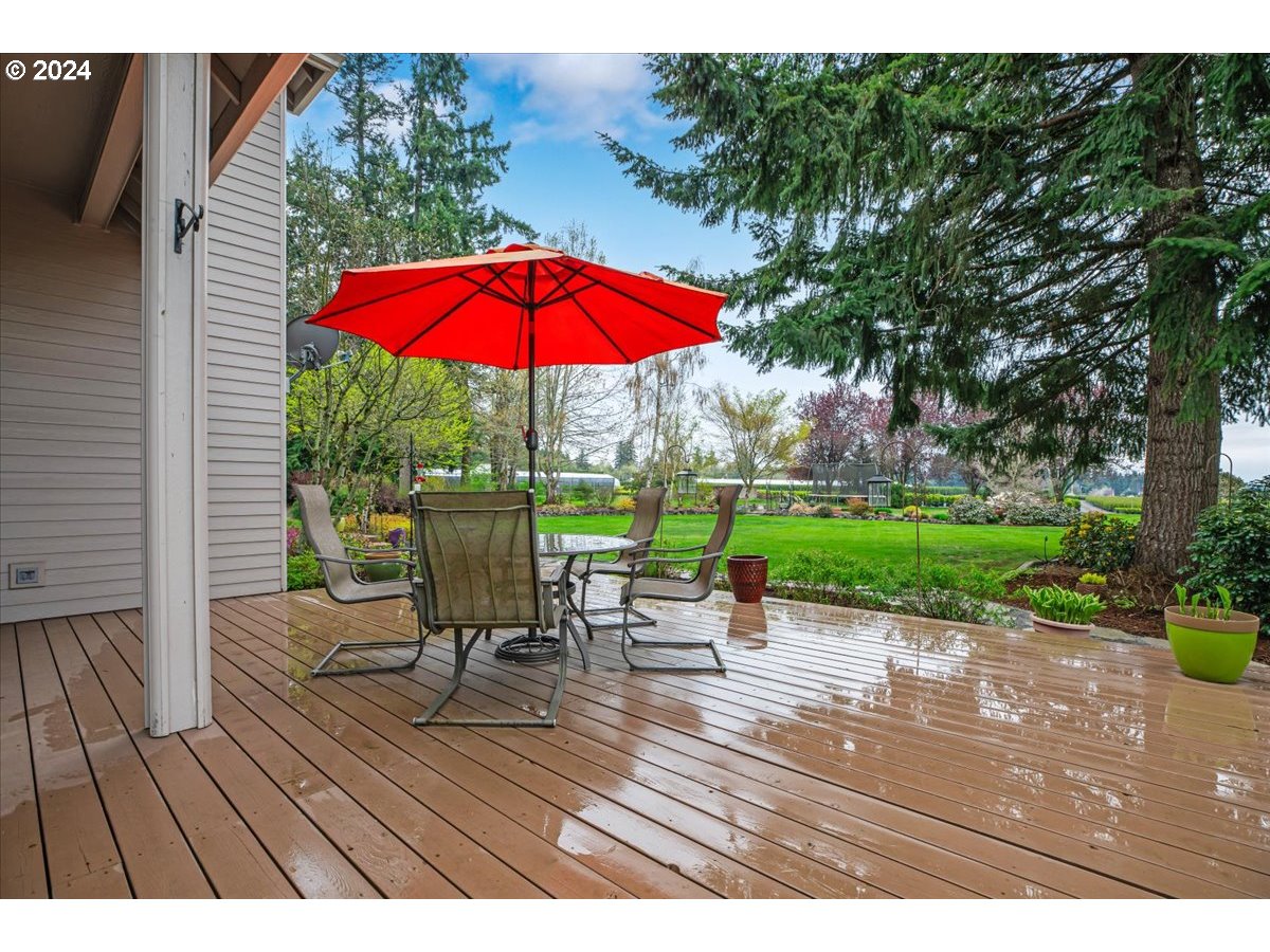 31938 Southeast Dodge Park Boulevard Gresham, OR 97080 - Photo 45 of 48 a view of a table and chairs on the deck