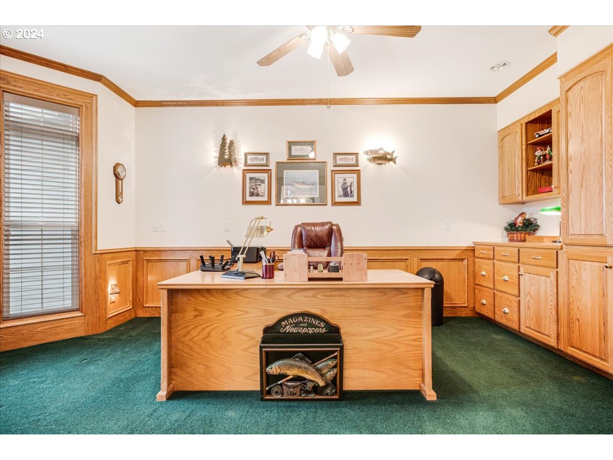 31938 Southeast Dodge Park Boulevard Gresham, OR 97080 - Photo 6 of 48 a living room with kitchen island furniture a stove and a window
