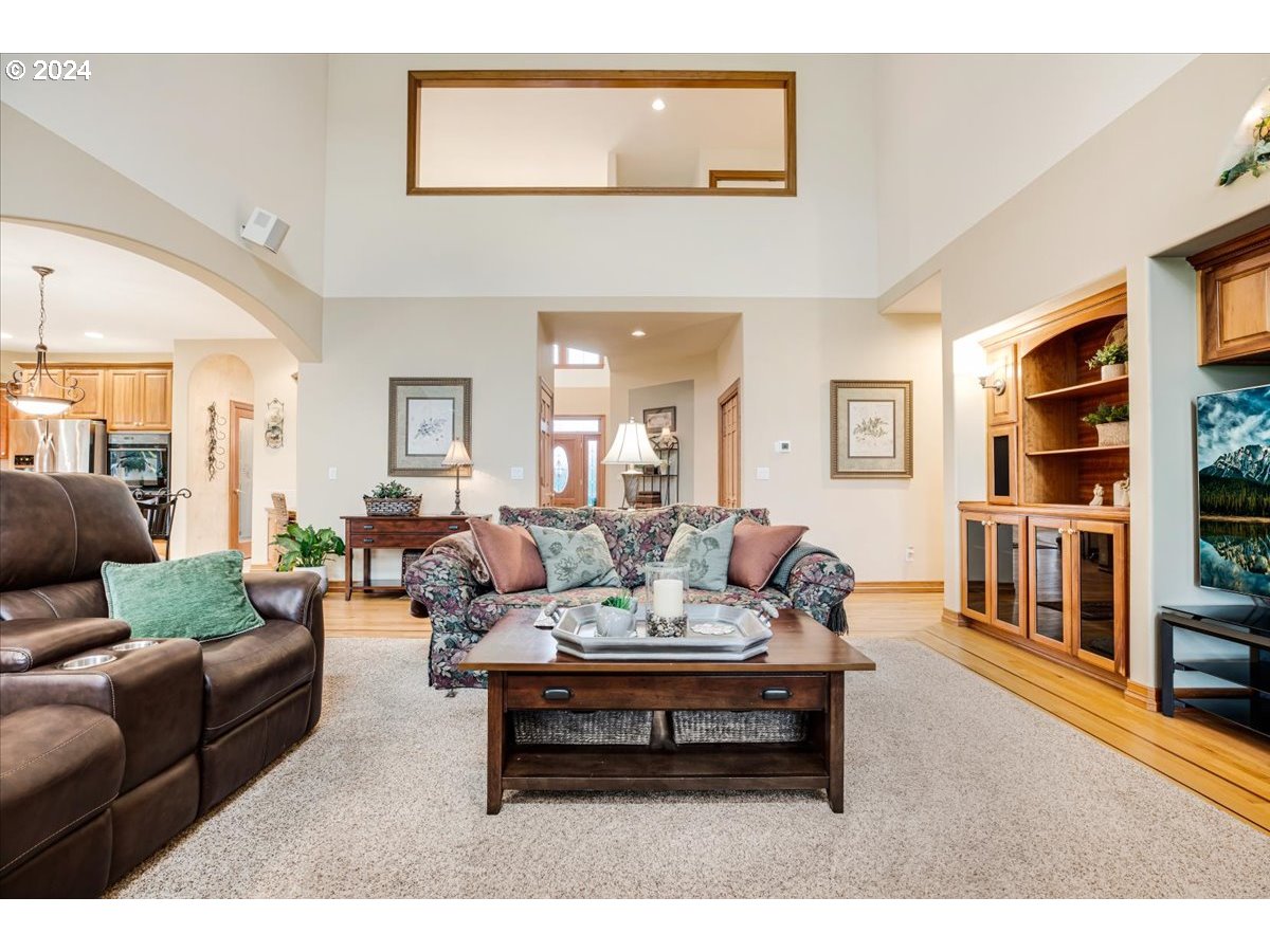 31938 Southeast Dodge Park Boulevard Gresham, OR 97080 - Photo 10 of 48 a living room with furniture and a book shelf