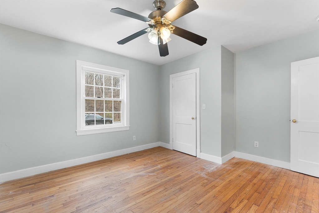 127 Old Millville Road Uxbridge, MA 01569 - Photo 14 of 30 wooden floor in an empty room with a window