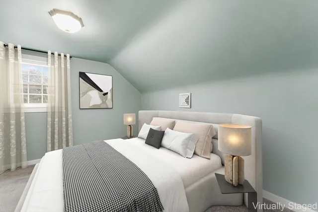 a bedroom with a bed and a painting