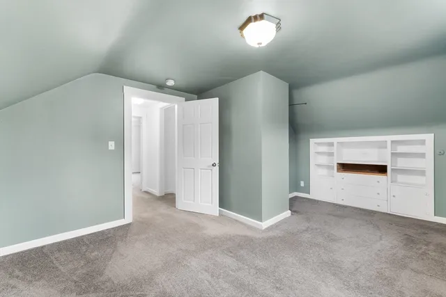 an empty room with a empty space and windows