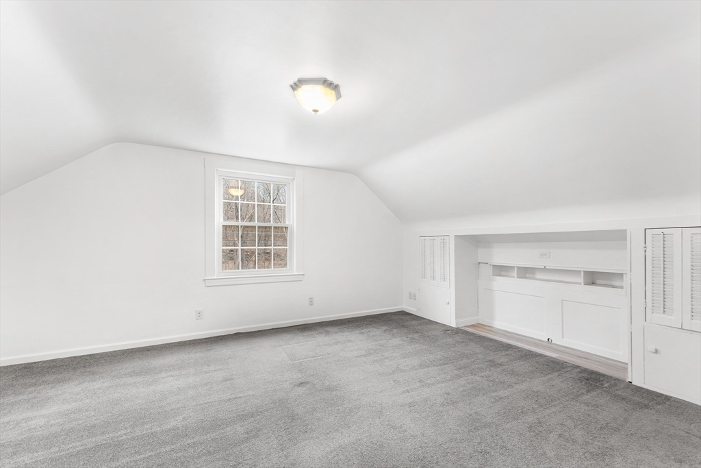 127 Old Millville Road Uxbridge, MA 01569 - Photo 21 of 30 an empty room with windows and cabinet